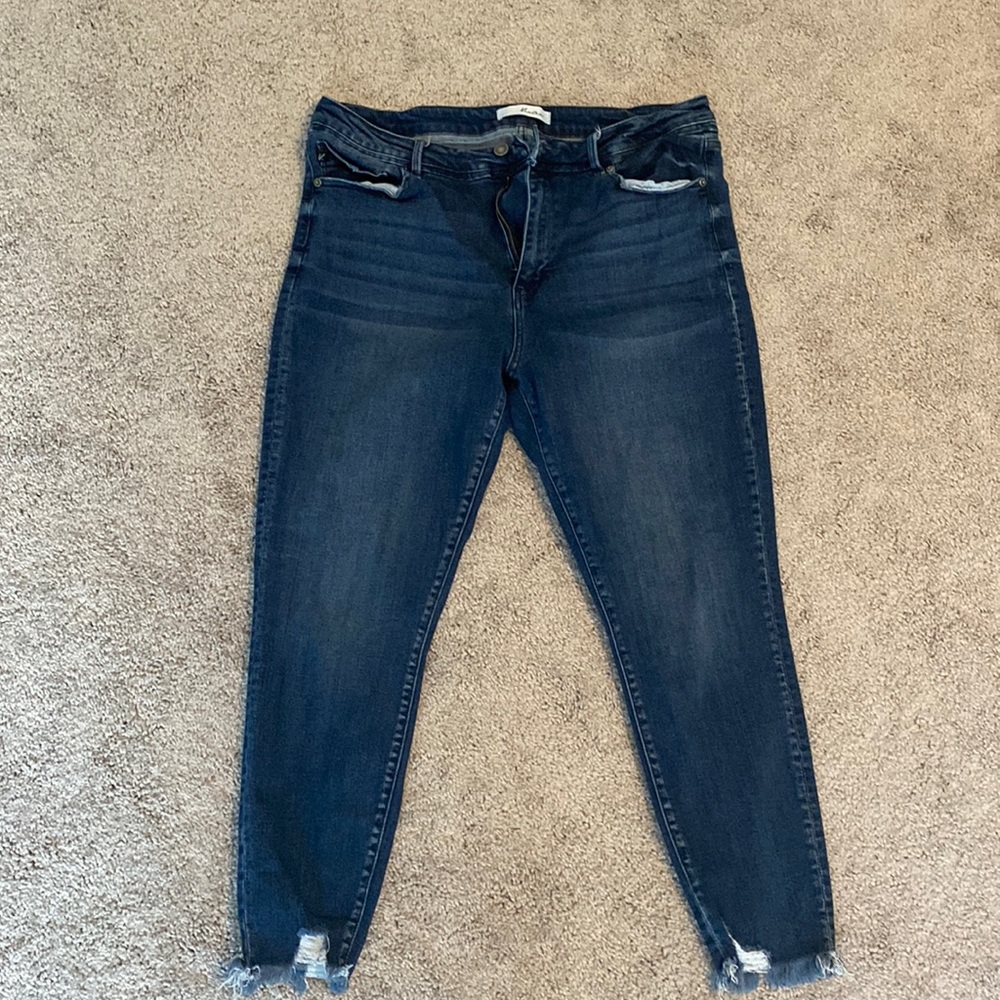 KanCan Women’s distressed jeans.